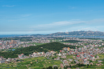 Fototapeta premium The mountain overlooks the rich villages and towns