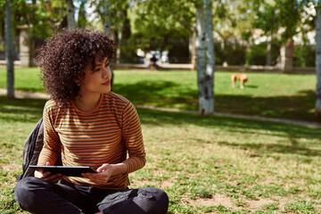 Cute young woman looking away thoughtfully