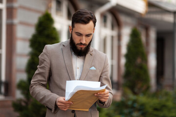 The entrepreneur and the project proposed to him. The lawyer reads the contract.carefully. A man...
