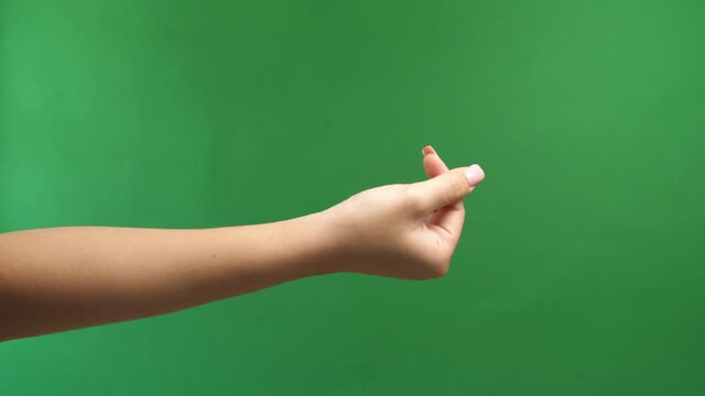 A Hand Signs Gesture To Be Little Heart From Tip Of Thumb And Index Finger On Green Screen Background
