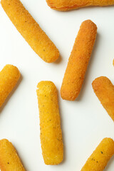 Flat lay with cheese sticks on white background