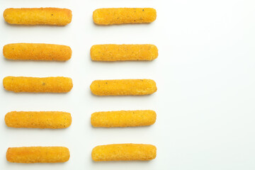 Flat lay with cheese sticks on white background