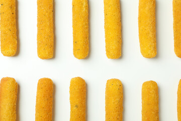 Flat lay with cheese sticks on white background