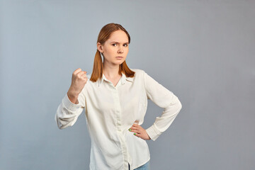 Beautiful girl frowning her face in displeasure. Dissatisfied shocked young woman posing isolated...