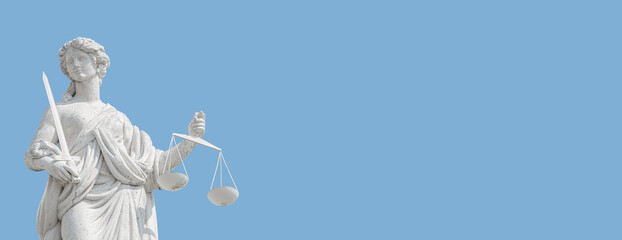 Banner with statue a judge woman with scales and sword at blue sky solid background in Potsdam,...