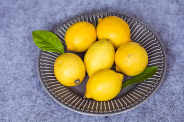 Fresh Yellow Lemons in a Dish .Top View.