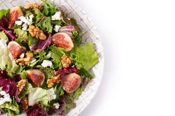 Figs salad with cheese and walnuts isolated on white background. Top view.Copy space