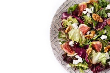 Figs salad with cheese and walnuts isolated on white background. Top view.Copy space