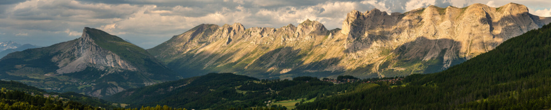 panoramic view from the col de noyer , showing the french alps in evening light ,devoluy , france holiday destination .
