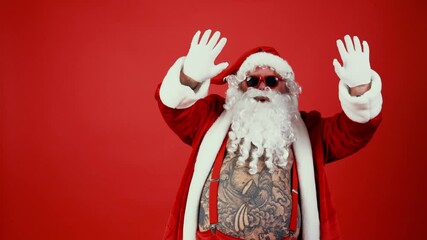 Alternative santa claus acting in studio for the christmas holidays ads