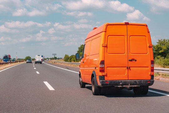 Orange Minivan On The Road