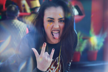 Young Woman At A Rock 'N' Roll Concert. Person Having Fun At A Halloween Party. Positive And Crazy...