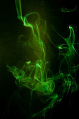Green smoke motion on black background.