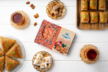 Top view of Turkish desserts on wooden background