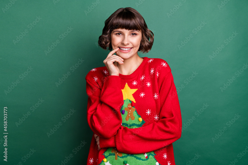 Wall mural Portrait of attractive cheerful brown-haired girl wearing festal pullover thinking isolated over green color background