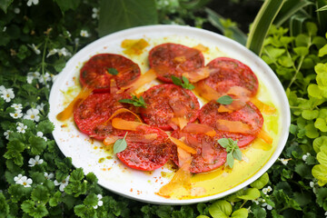 Fresh ripe tomatoes with bottarga