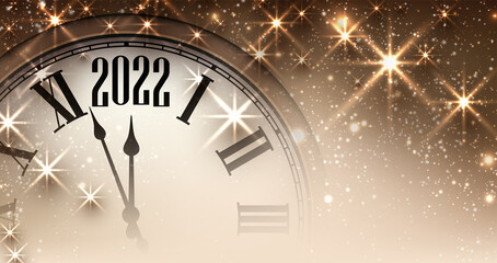 Fototapeta na wymiar Half hidden golden new year clock showing 2022.