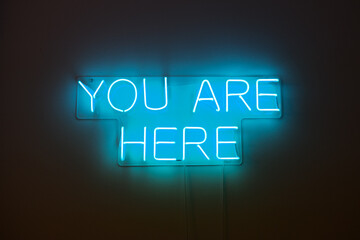 Neon sign 'you are here'