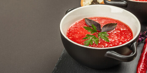 Spicy autumn tomato soup. Healthy hot food, garlic, chili, basil