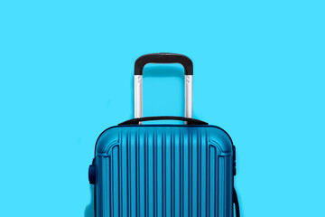blue suitcasei isolated on blue background - 458710110