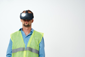 worker in a white helmet construction VR glasses studio posing