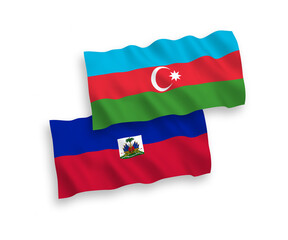 Fototapeta premium National vector fabric wave flags of Republic of Haiti and Azerbaijan isolated on white background. 1 to 2 proportion.