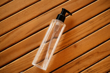 hand sanitizer on a wooden table top view. antiseptic