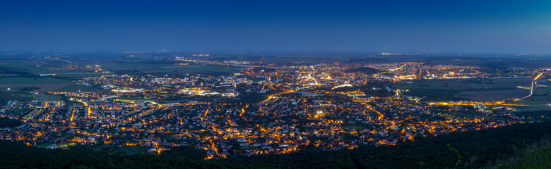 Fototapeta na wymiar Panoramic aerial view on city after sunset with street lights, Nitra, Slovakia