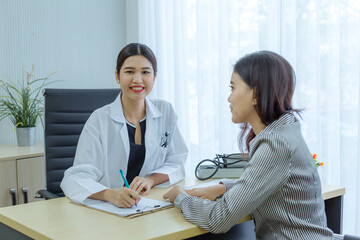 doctor consulting and do treatment to patient at examination room medical office in hospital