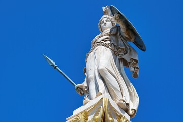 Athena or Athene, often given the surname Pallas, is an ancient Greek goddess associated with wisdom, a statue in the center of Athens