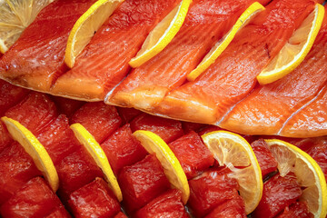 Sliced smoked salmon with lemon.