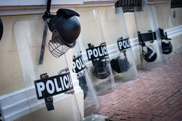 Police equipment such as shield and helmet on the street 