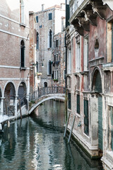 Fototapeta na wymiar Characteristic bridge over one of the Venetian canals 