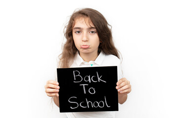 schoolgirl looking at camera with back to school text. sad student because school is open. education concept background, banner, poster.