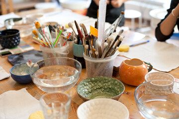 table at clay pottery artist class with pottery tools