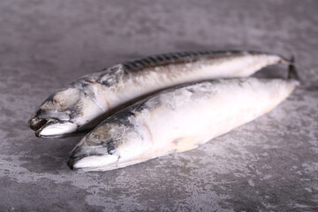 frozen mackerel fish is lying on the table