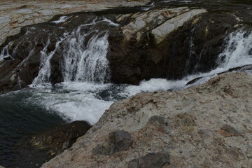 The beautiful clear waterfall along with the Makomanai river in Sapporo Japan