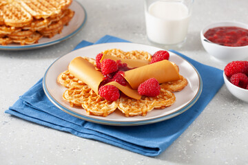 waffles with Norwegian brunost traditional brown cheese and raspberry jam
