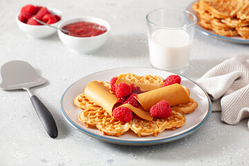 waffles with Norwegian brunost traditional brown cheese and raspberry jam