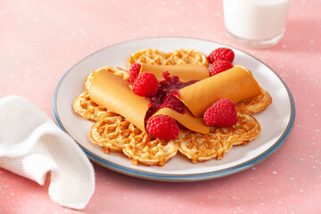 waffles with Norwegian brunost traditional brown cheese and raspberry jam