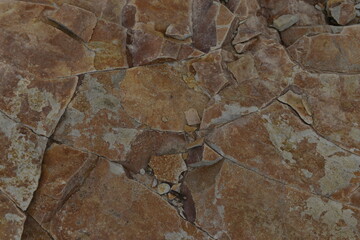 The reddish marble-like rock stones along with the river in Sapporo Japan