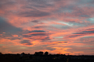 spectacular sunset with pink and orange clouds