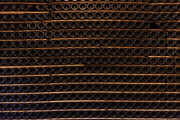 Bottles of wine and cava resting in the cellar