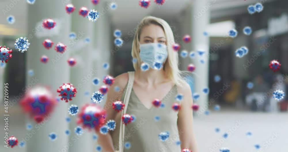 Poster Animation of virus cells over caucasian female wearing face mask in street