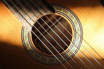 Naklejka premium Detail of classical Spanish acoustic guitar sound hole and part of the fretboard