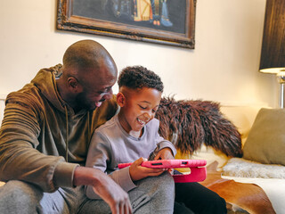 Father with son playing at home © Cultura Creative