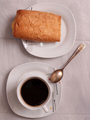 Cup of coffee and beans on a wooden kitchen table