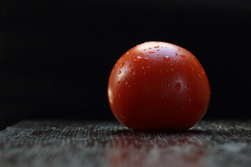 Fototapeta na wymiar tomato on black