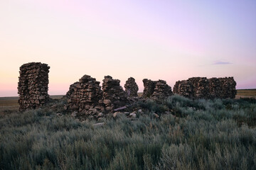 An old ruined house at sunset