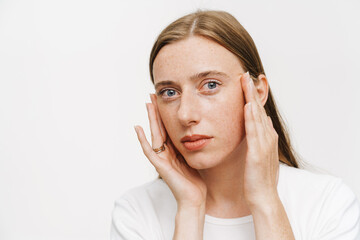 Portrait of a young white woman with long red hair